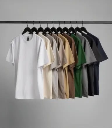 Blank T-shirts in white, cream, beige, green, grey and black on hangers