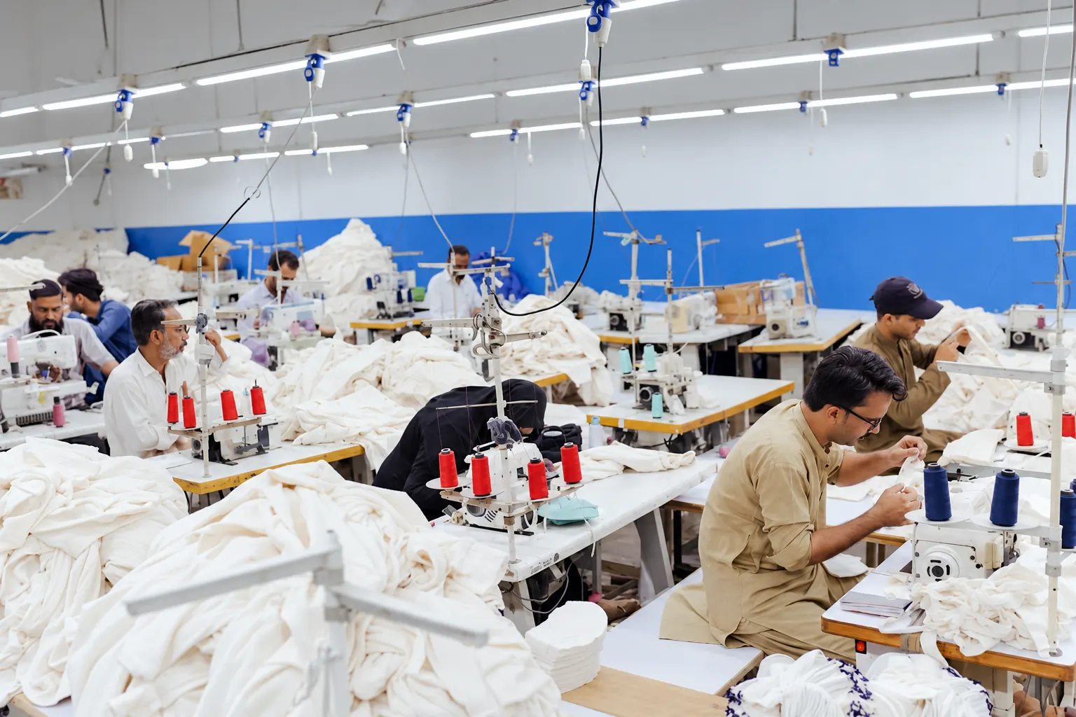 Inside the stitching department Overview of the textile stitching department and sewing workstations.