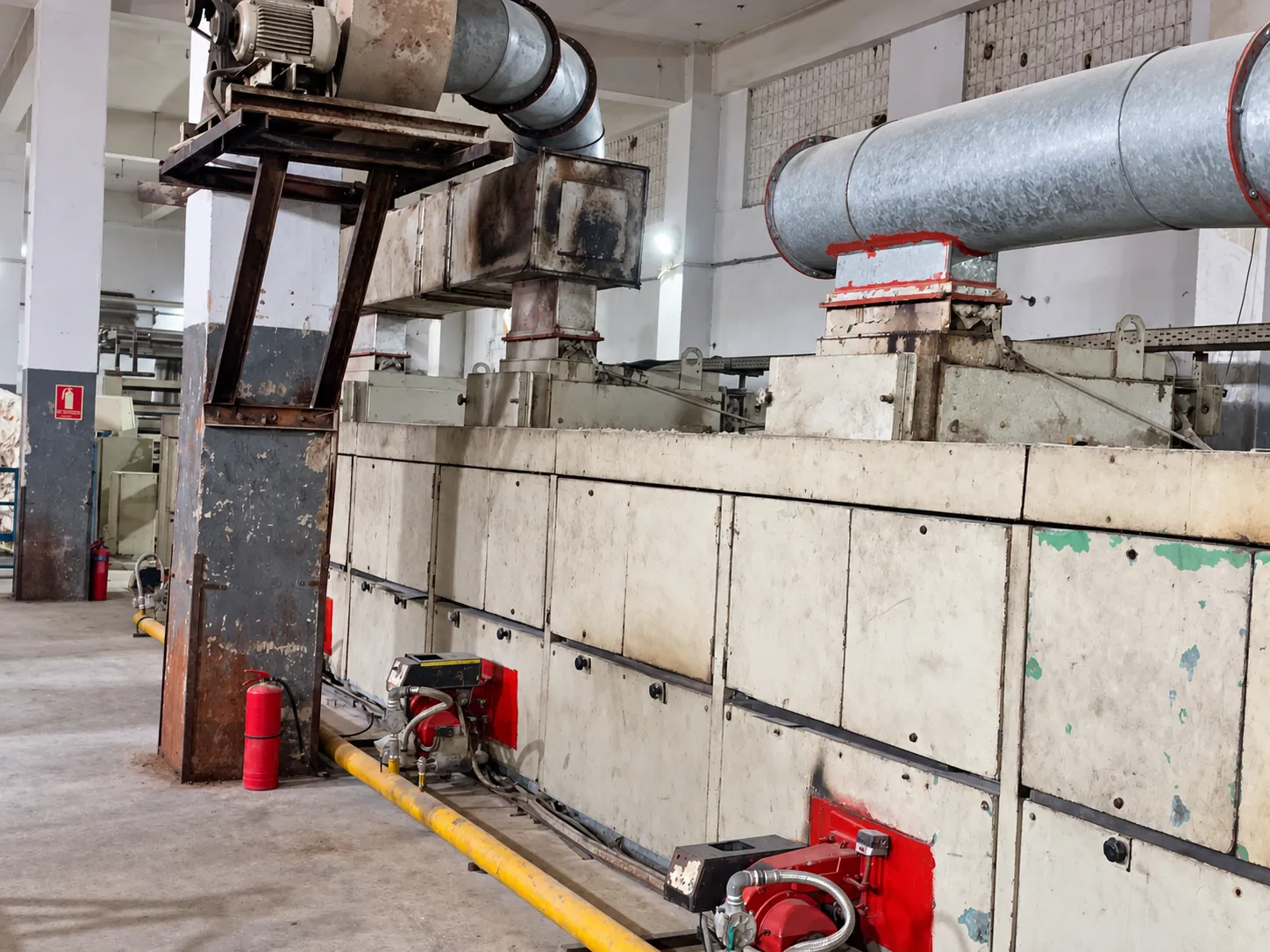 Textile finishing equipment Industrial textile finishing equipment and extraction ductwork.
